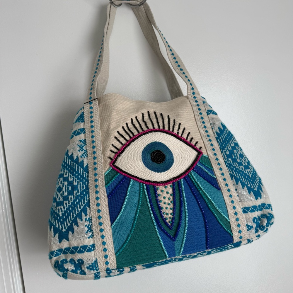 America & Beyond Wanderlust Evil Eye Tote, a hand-woven jacquard bag